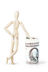 Man leaned against a big bundle of dollars. Abstract image with a wooden puppet