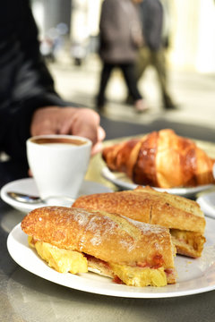 coffee, croissant and spanish omelette sandwich