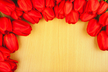 Naklejka na ściany i meble Red tulips on a wooden background_5