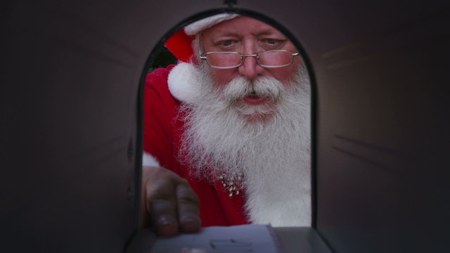 Santa opening mailbox