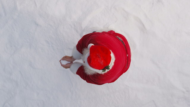 Santa Claus throws snow into air, slow motion