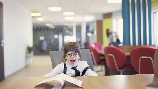 office kid throw paper in air. slow motion