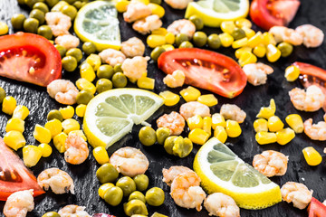 Colorful vegetable or mediterranean cuisine background with shrimps