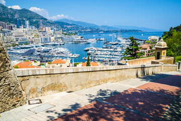 View of luxury yachts and apartments in harbor of Monaco, Cote d'Azur.
