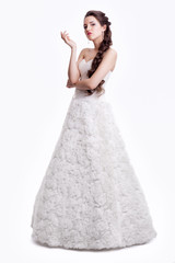 Portrait of beautiful young brunette woman bride  in white Weddi