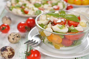 Salad with cherry tomatoes, eggs and cheese