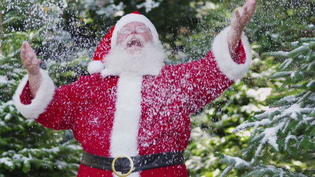 Slow motion shot of Santa Claus throwing snow