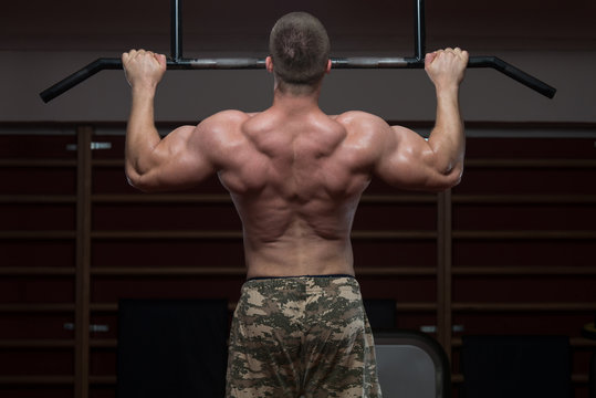 Bodybuilder Doing Pull Ups Best Back Exercises