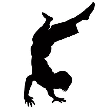 Young boy learning to break dance