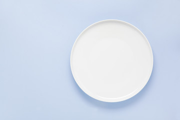 empty plate on a blue background