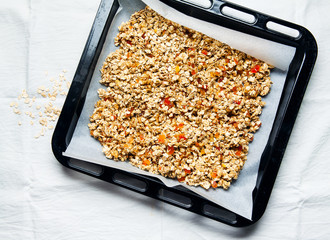preparation of granola. on a baking sheet for oven