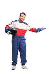 Car racer holding a helmet and gesturing