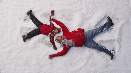 Father and son playing in snow