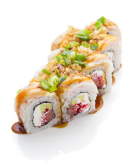 Sushi with shrimp avocado salmon and cheese strewed with green onion. Crunch Roll. With delicious sauces. Over white background.