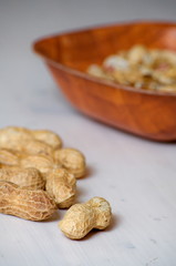 Peanuts in a brown bowl