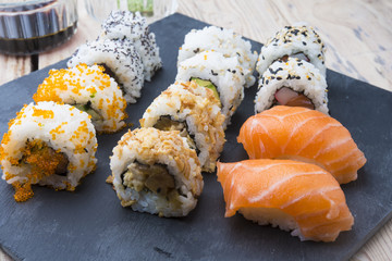 Sushi rolls on a slate plate