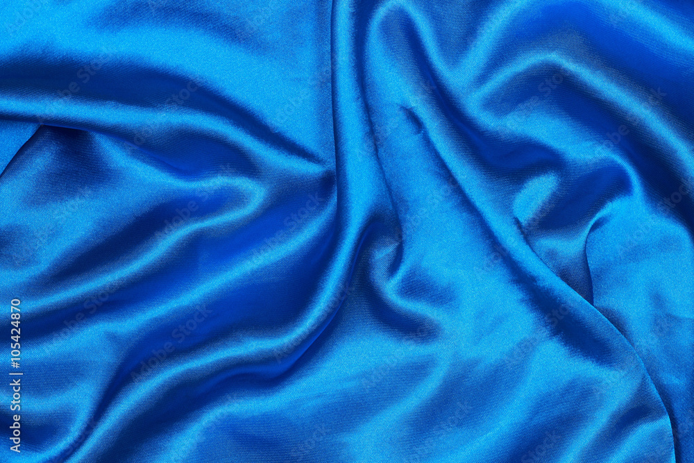 Poster curved design on blue silk for pattern and background