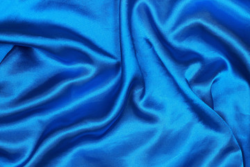 Curved design on blue silk for pattern and background