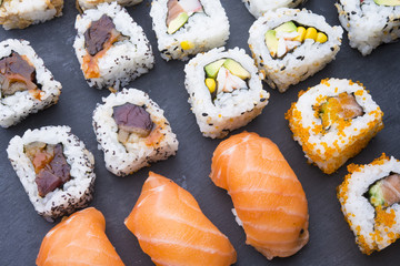 Sushi rolls on a slate plate