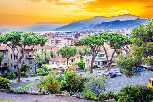Amazing colorful sunset over the beautiful Italian city Bordighera. © anilah