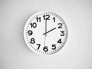 Monochrome clock on the wall for background