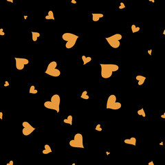 The seamless vector pattern with the golden hearts on black background