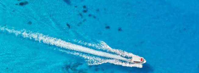 Aerial view of speed boat in azure sea