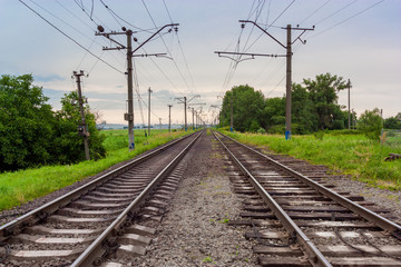 Naklejka na ściany i meble Wide view on a railroad runs to horizint