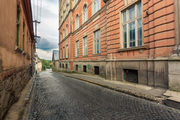 Fototapeta na wymiar Wide view on street of old european city