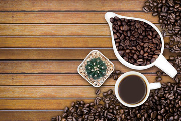 Coffee beans on wood texture background