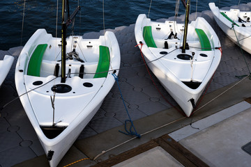 Sail boats docked in the Newport Beach Marina.