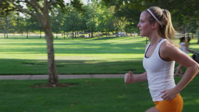 Healthy young woman jogging in park