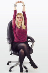 Stretching arms in office chair
