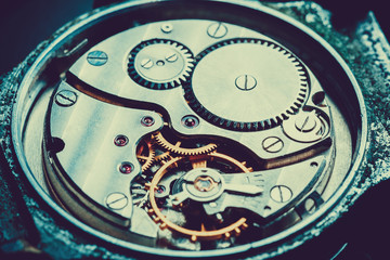 mechanism antique vintage wrist watch beautiful original dark metallic background in the  technique of blue toning