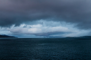 Eye shaped gathering storm at dusk near Mull, Scotland