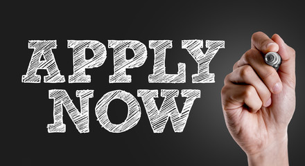 Hand writing the text: Apply Now
