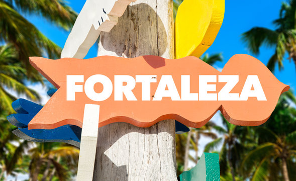Fortaleza signpost with palm trees