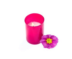 the burning pink candle and pink a flower
