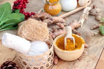 Turmeric powder with honey and milk for scrub.