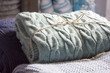 Warm knitted blankets folded stack. Comfort and convenience
