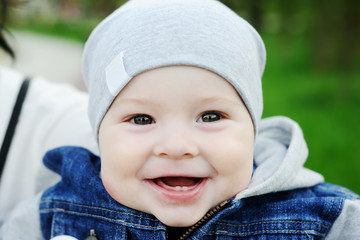 Baby with two milk teeth smiling at the camera