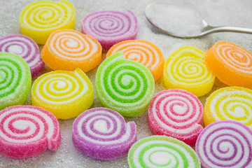 Fototapeta na wymiar Marshmallows with jelly and sugar on spoon