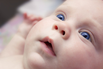 Newborn baby with blue eyes