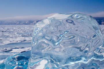 A piece of blue ice on the surface of the frozen Lake Baikal
