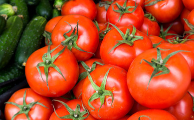 Healthy food, background. Red tomatoes with cucambers