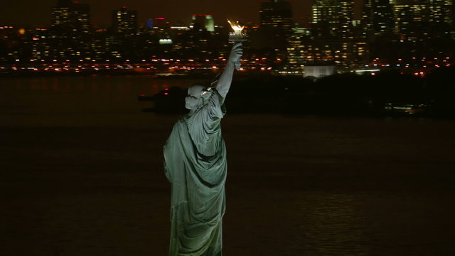 Statue of Liberty and Manhattan at night