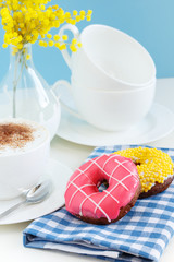 Breakfast with donuts and cappuccino