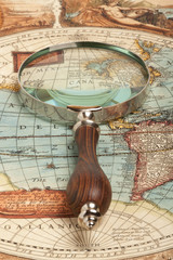 Plakat Magnifying glass and map