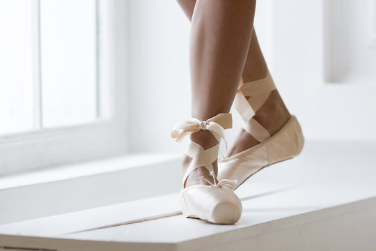 Legs of a ballerina in pointe
