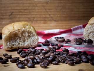 Coffee and bread wooden background